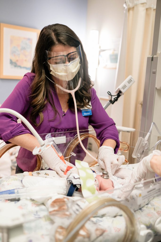 Dr. Cristina Miller cares for a baby