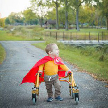 Elijah dressed as a superhero in a cape