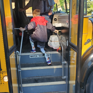 Elliot getting on the bus