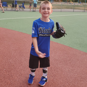 Elliot playing baseball