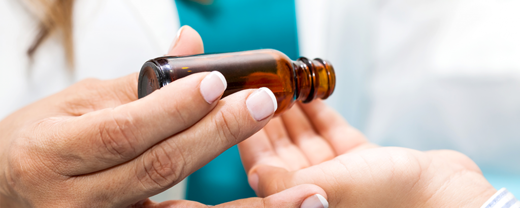 Doctor giving child essential oils