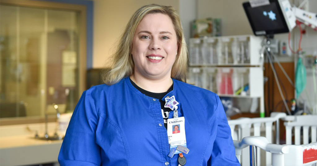 Children's Minnesota employee smiling in their scrubs