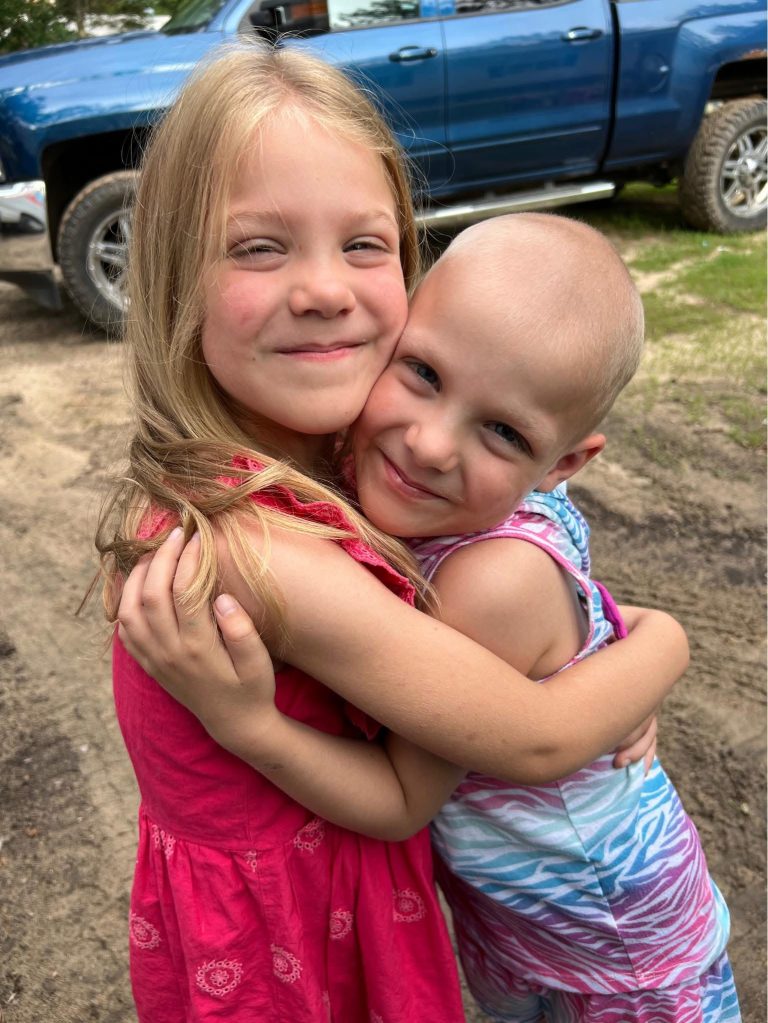 Photo of twin sisters hugging