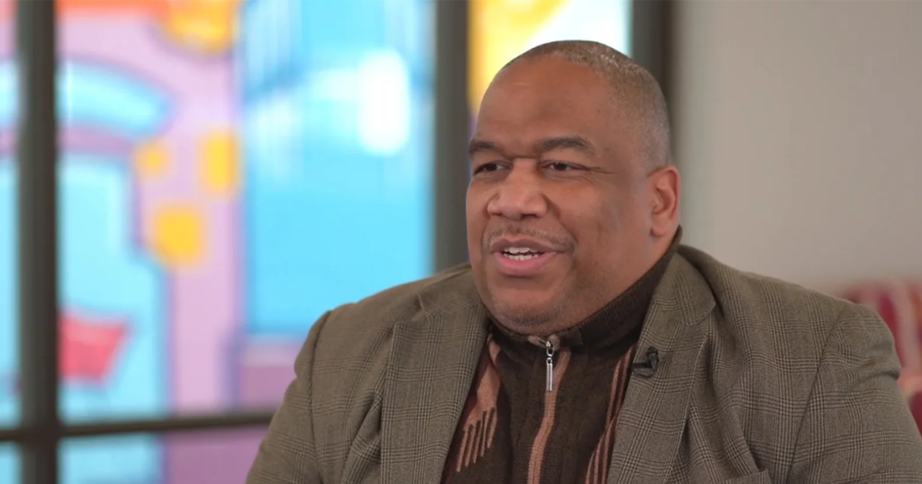 James Burroughs talking in a video