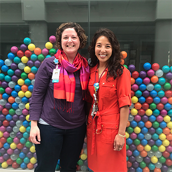 Laura Plasencia and Dr. Gigi Chawla wearing orange