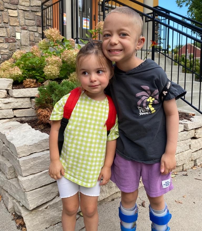 Giorgio smiling next to his sister Giada