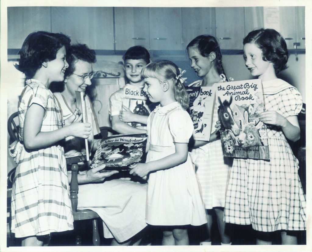 Eleanor Sackett accepting book donations, circa 1950s.