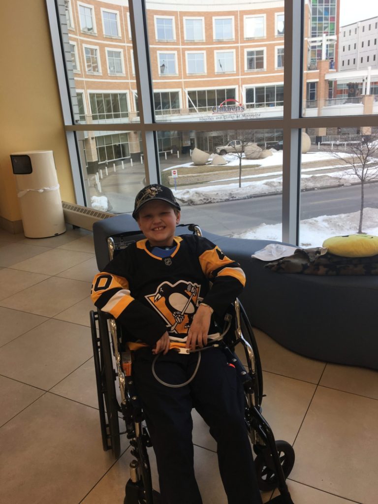 Westen in a wheelchair at Children's Minnesota going home
