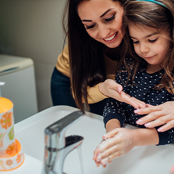 Mom and child washing their hands Mom and child washing their hands