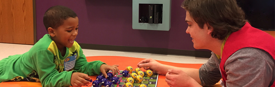 Volunteer plays checkers