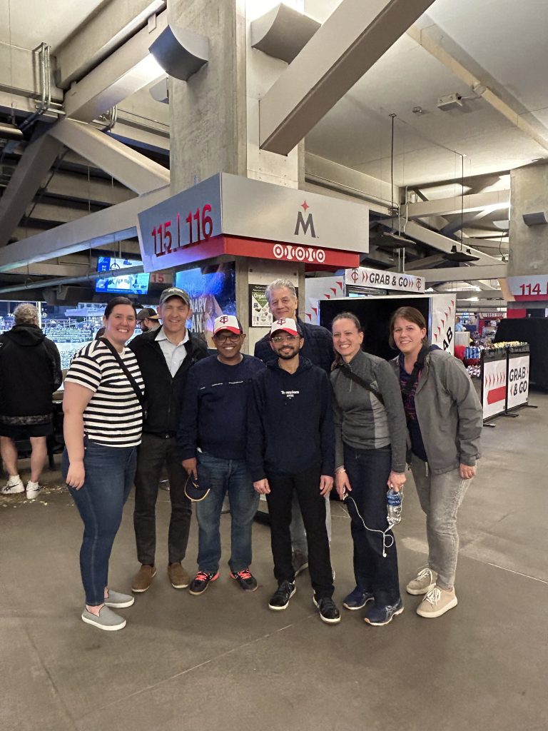 Dr. Debasis Das and Dr. Shubhadeep Das with the Children's Minnesota Cardiovascular team at a Twins game.