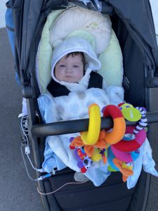 Photo of Colton in a stroller on his way home from the hospital.