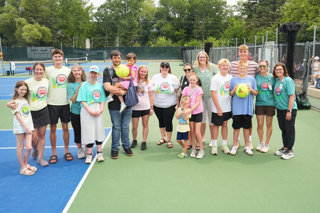 Children's Minnesota staff and patients pose together at the 2026 Pine Tree Apple Tennis Classic.