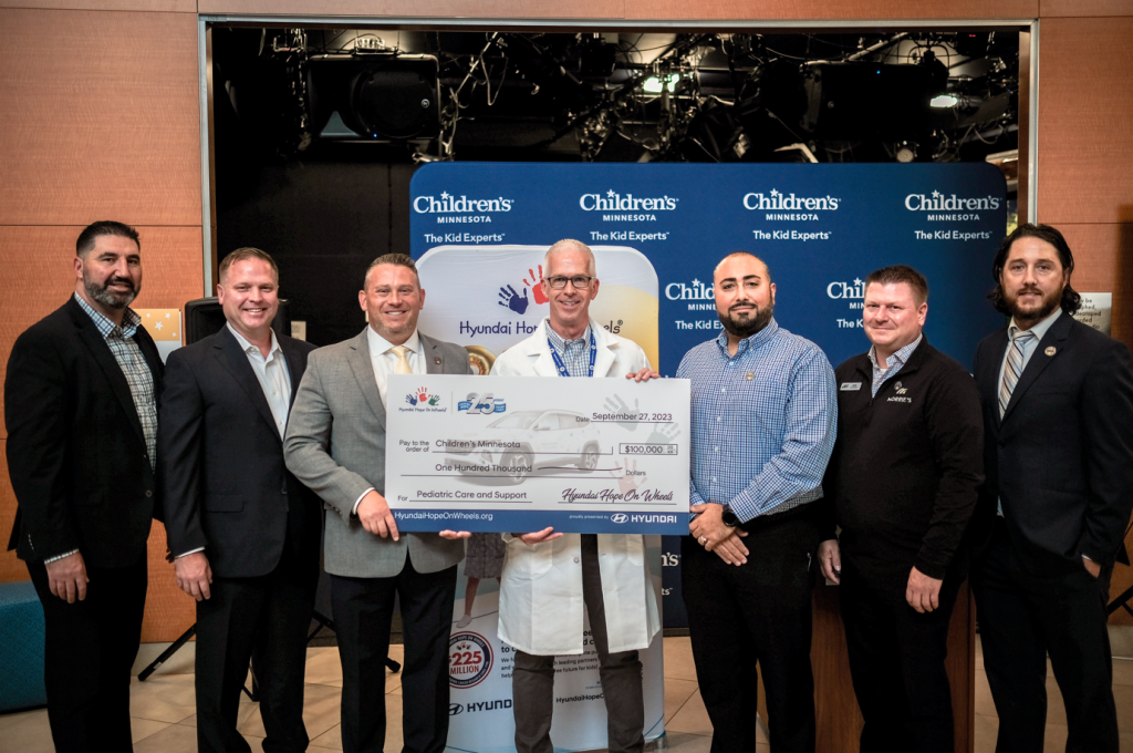 Dr. Michael Richards, center, awarded $100,000 Hyundai Impact Grant.