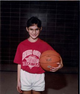 Dr. Jen Pratt as a kid holding a basketball