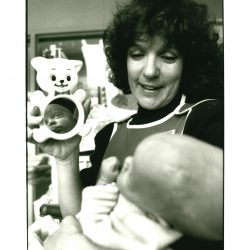 A photo from our archives of a volunteer at Children’s Minnesota working with a patient