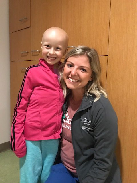 Kylie and Sydney Gilbertson, one of her nurses in the hospital smiling