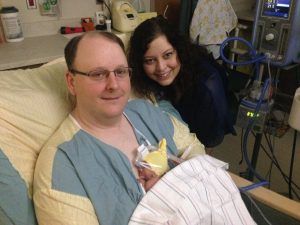 Sydney in the NICU with her parents