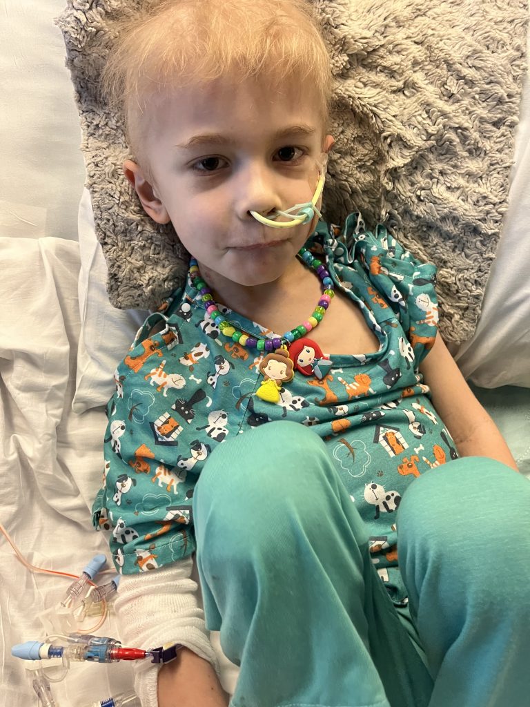 Photo of Freddie in a hospital bed