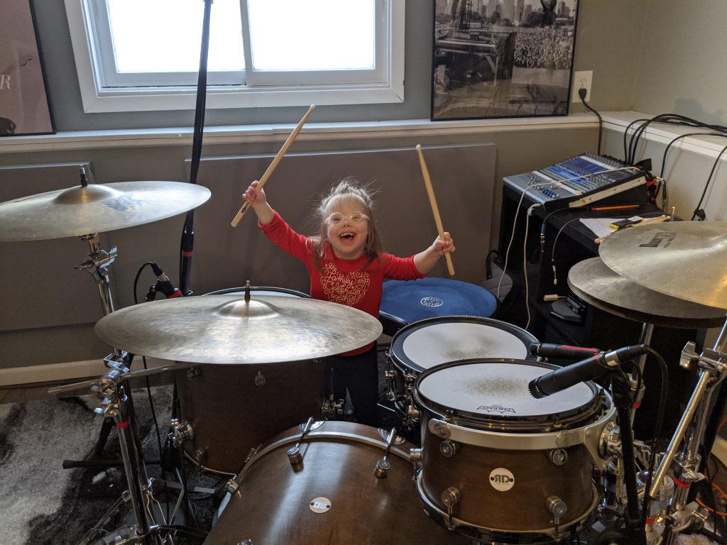 Alyssa plays the drums