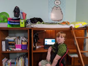 Sam sitting in his room