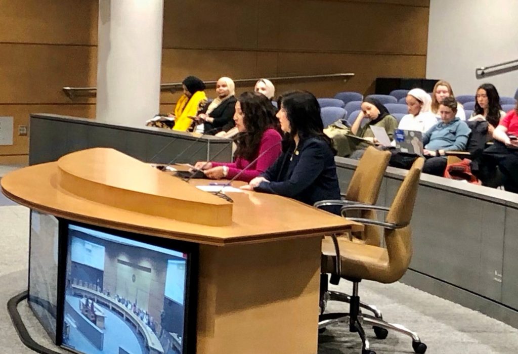 Dr. Gigi Chawla (left) testifies in favor of free school meals for all Minnesota children.