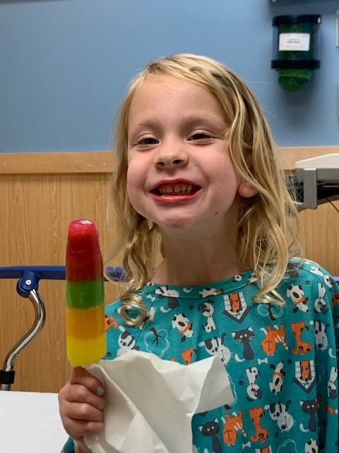 Callie eating a popsicle after having her tonsils removed