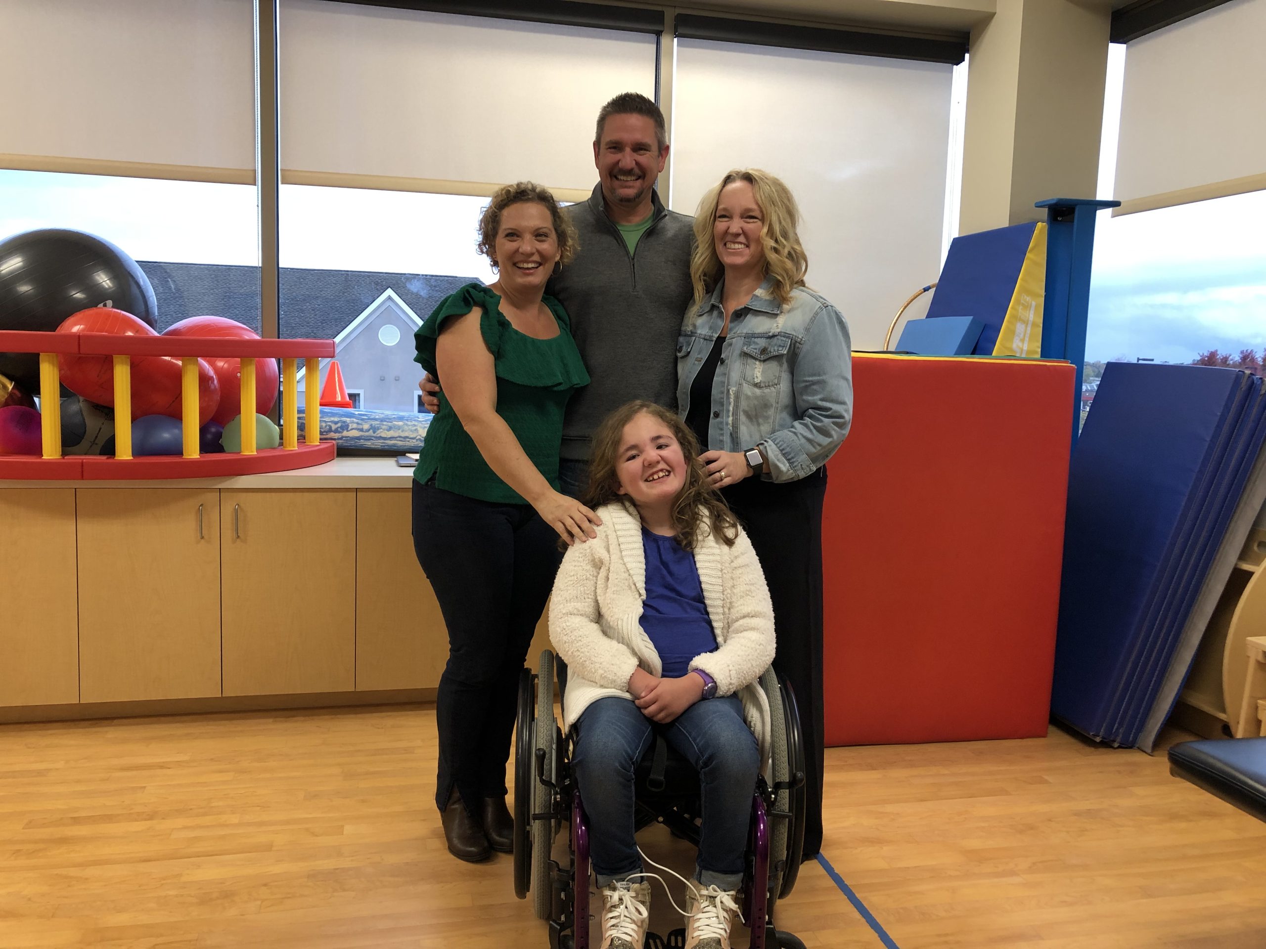 Miss Nina with Addison and her parents in the hospital