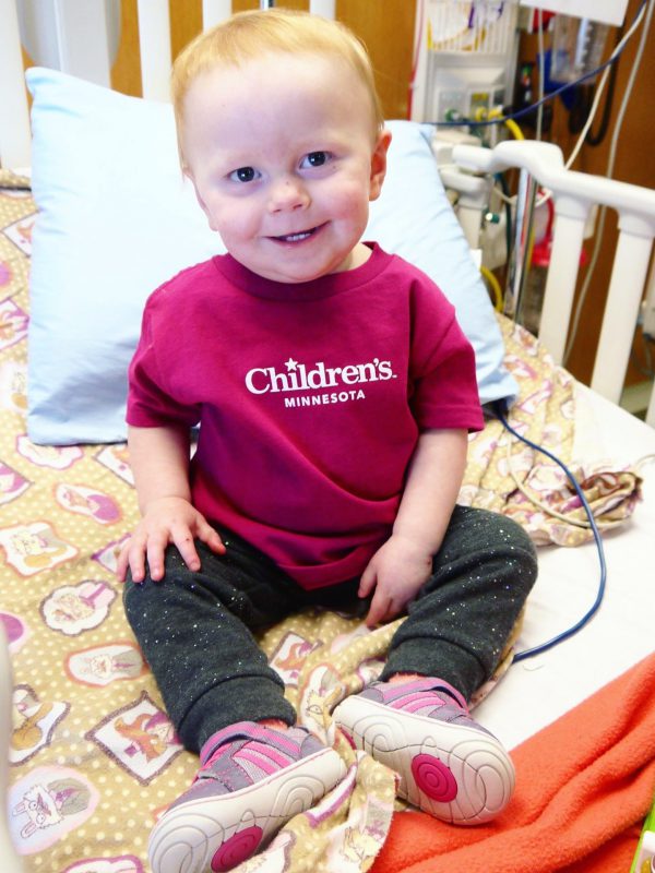 Kenzie in a Children's Minnesota shirt at the hospital.