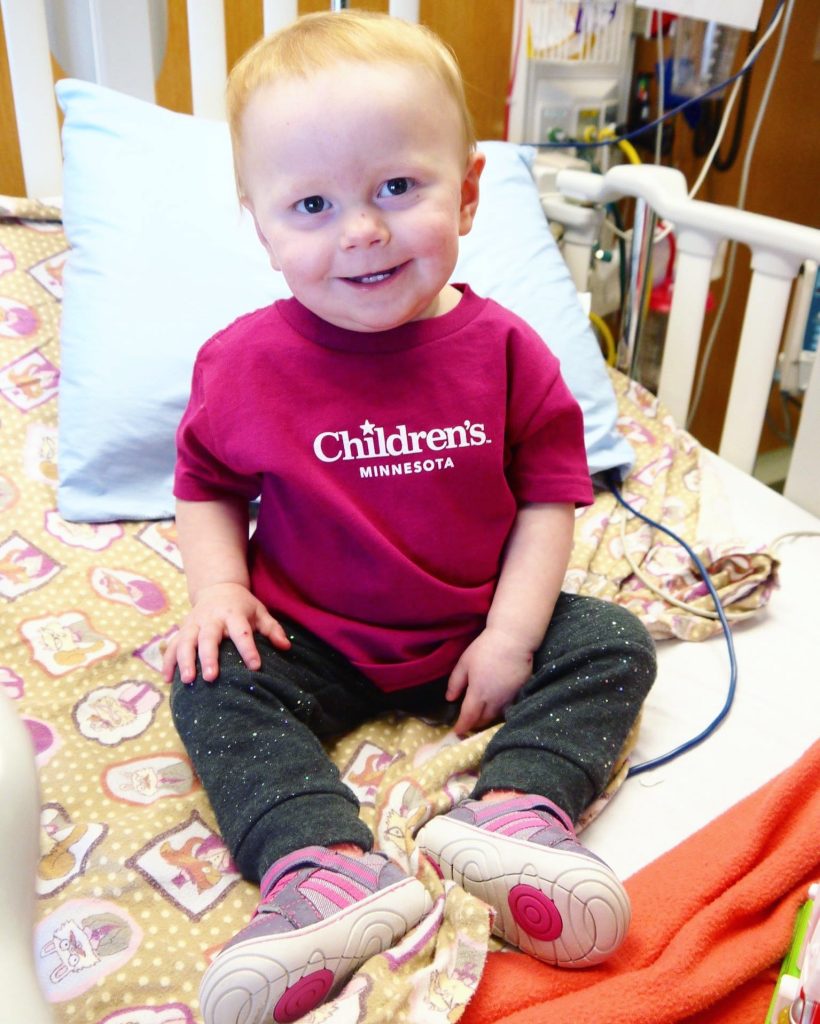 Kenzie in a Children's Minnesota shirt at the hospital.