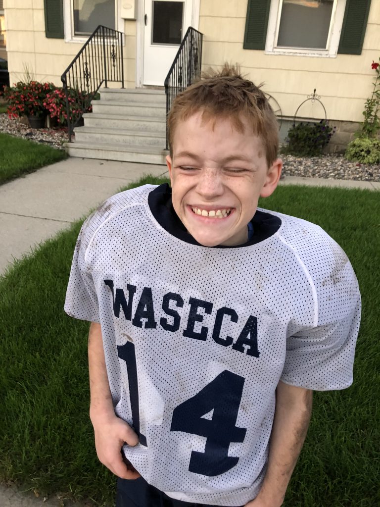 Kaden in his football uniform and gear