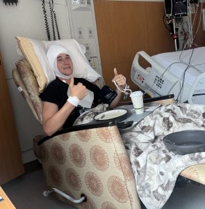 Wyatt in the hospital after surgery sitting up in a chair