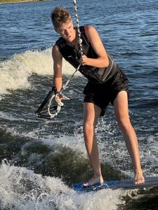 Wyatt wakeboarding on the lake