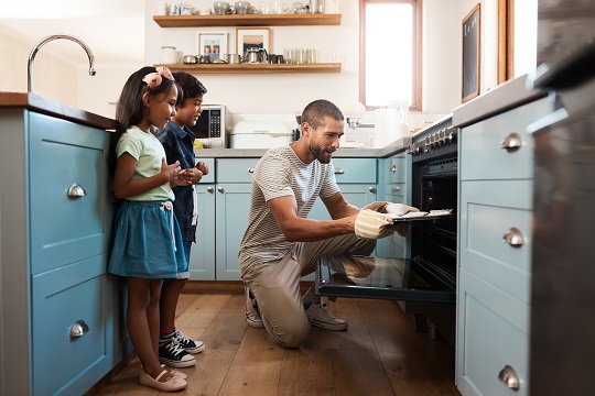 Dad baking with son and daughter