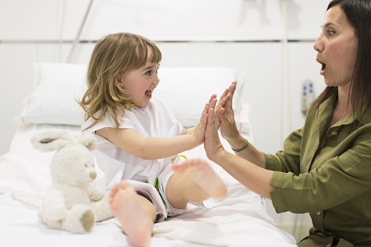 Social worker giving child high five