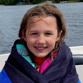 One of Kelly's daughters on a boat with a towel wrapped around her