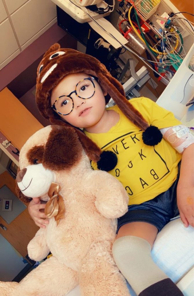 Joshua with a teddy bear in hospital