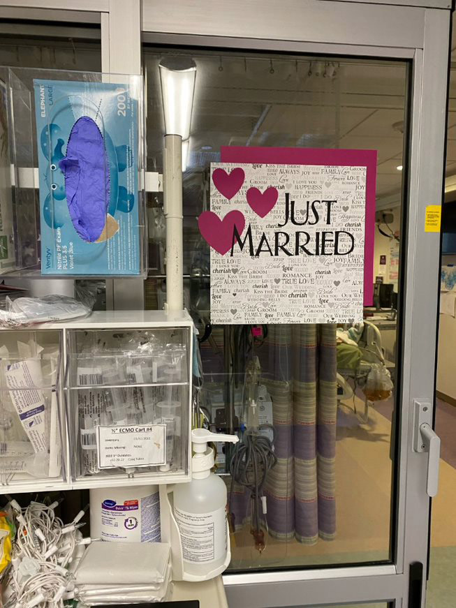 just married sign on room door