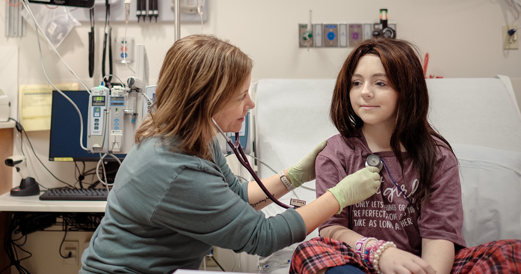 Children's Minnesota kid expert working with cancer patient