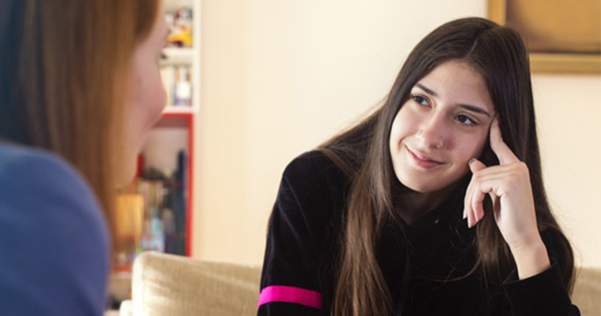 Teenage girl talks with therapist