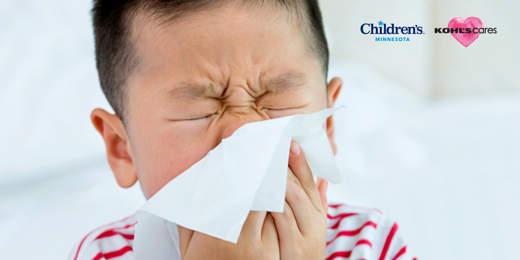Kid blowing his nose