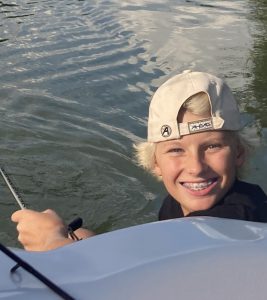 Photo of Matty fishing on a lake.