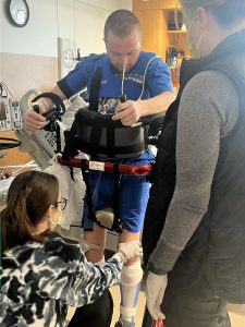 Max standing with the support of body braces.
