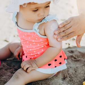 Putting sunscreen on a baby