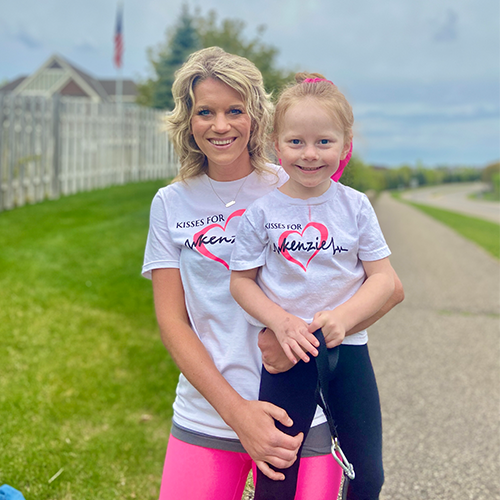 Kenzie and her mom in "Kisses for Kenzie" t-shirts on