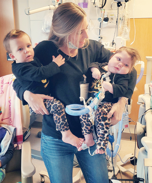 Erinn Frees, MA, MT-BC, board-certified music therapist at Children’s Minnesota, helping a patient Erinn Frees, MA, MT-BC, board-certified music therapist at Children’s Minnesota, helping a patient