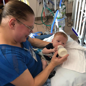 Daniel getting fed a bottle