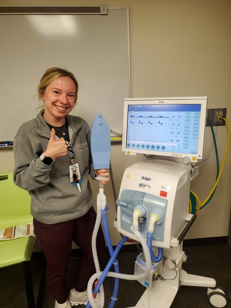 Miranda Weakley next to respiratory machine