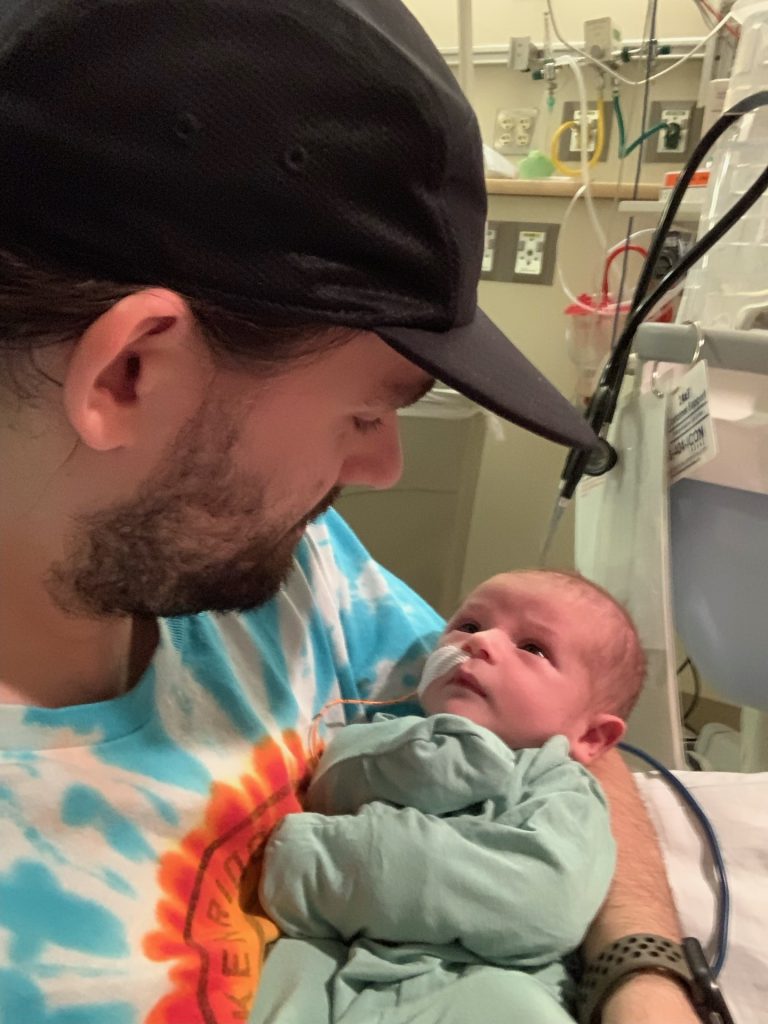 Michael holding newborn Murphy