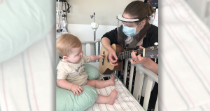 Erinn Frees, MA, MT-BC, board-certified music therapist at Children’s Minnesota, helping a patient